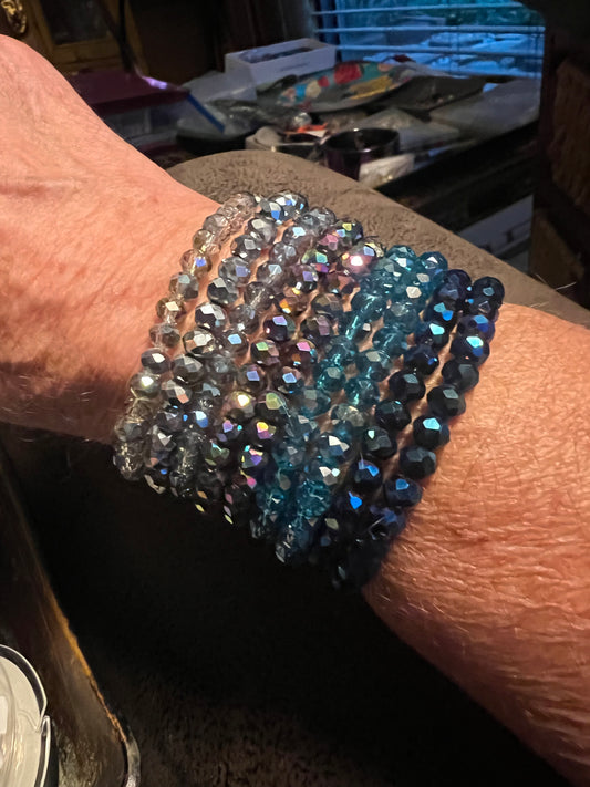 Stretch beaded bracelets . 3 and 4 millimeter crystal beads .